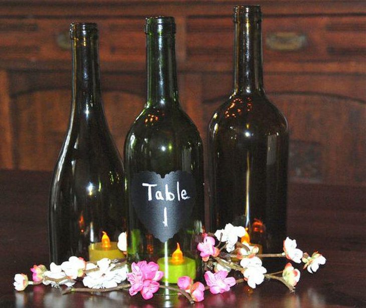 Stunning Wine Bottle With Chalkboard Heart Number Centerpiece