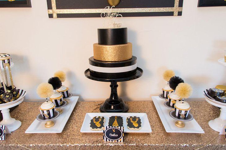 Stylish black and gold Christmas dessert table