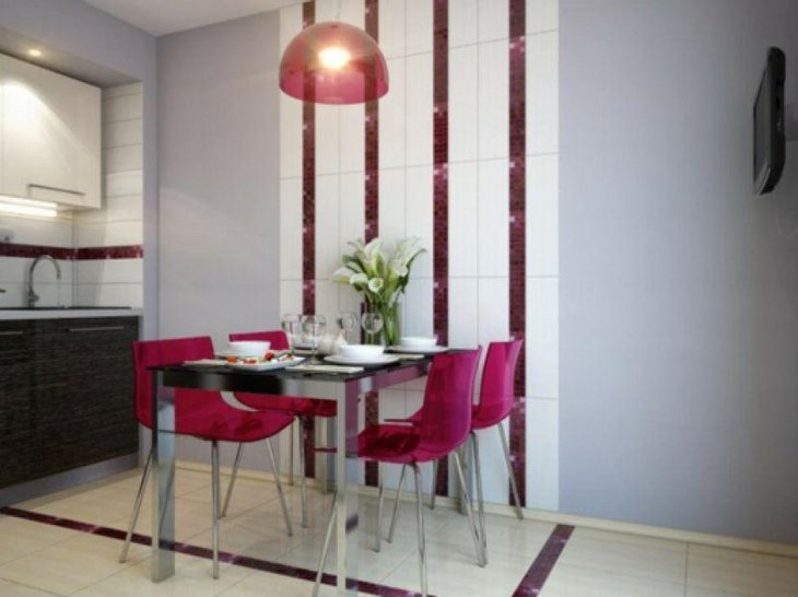 Stylish modern dining table in black with pink chairs