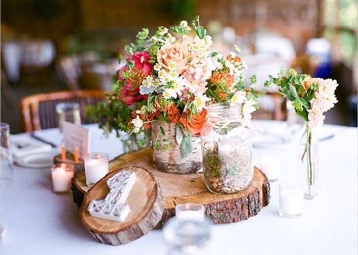 Stylish rustic vase and wooden slab centerpiece