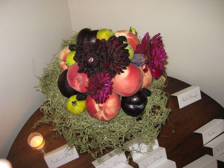 Summer wedding table decoration with fresh fruit centerpiece