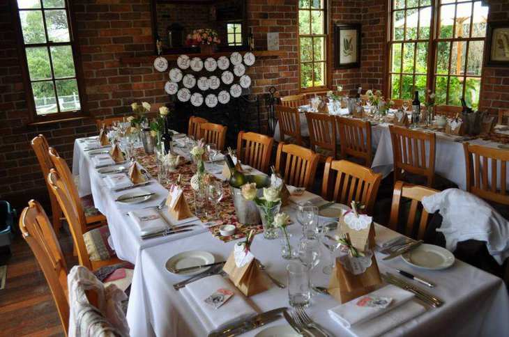 Sweet 80th birthday guest table decorated with floral accents