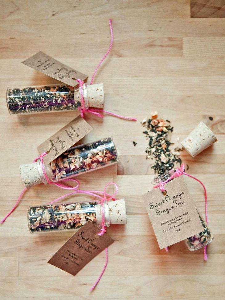 Sweet bottles with mixed orange ginger tea party favors