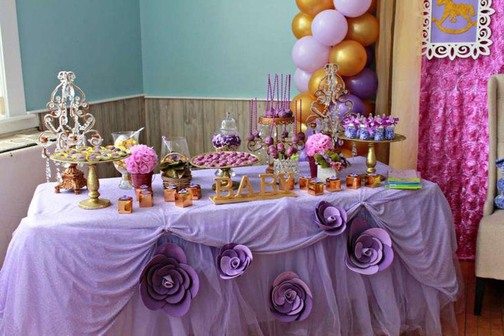 Sweet purple themed baby shower candy table decor