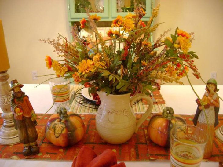 Thanksgiving Decorations With Yellow Flower And Green Leaves Mounted In White Porcelain Vases