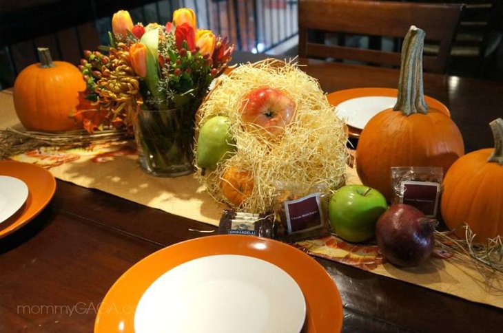 Thanksgiving Table Setting With Flowers and Pumpkins