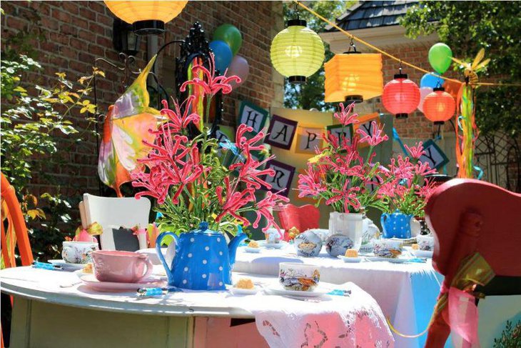 The spring birthday tables are decked up with Mad Hatter themed accessories