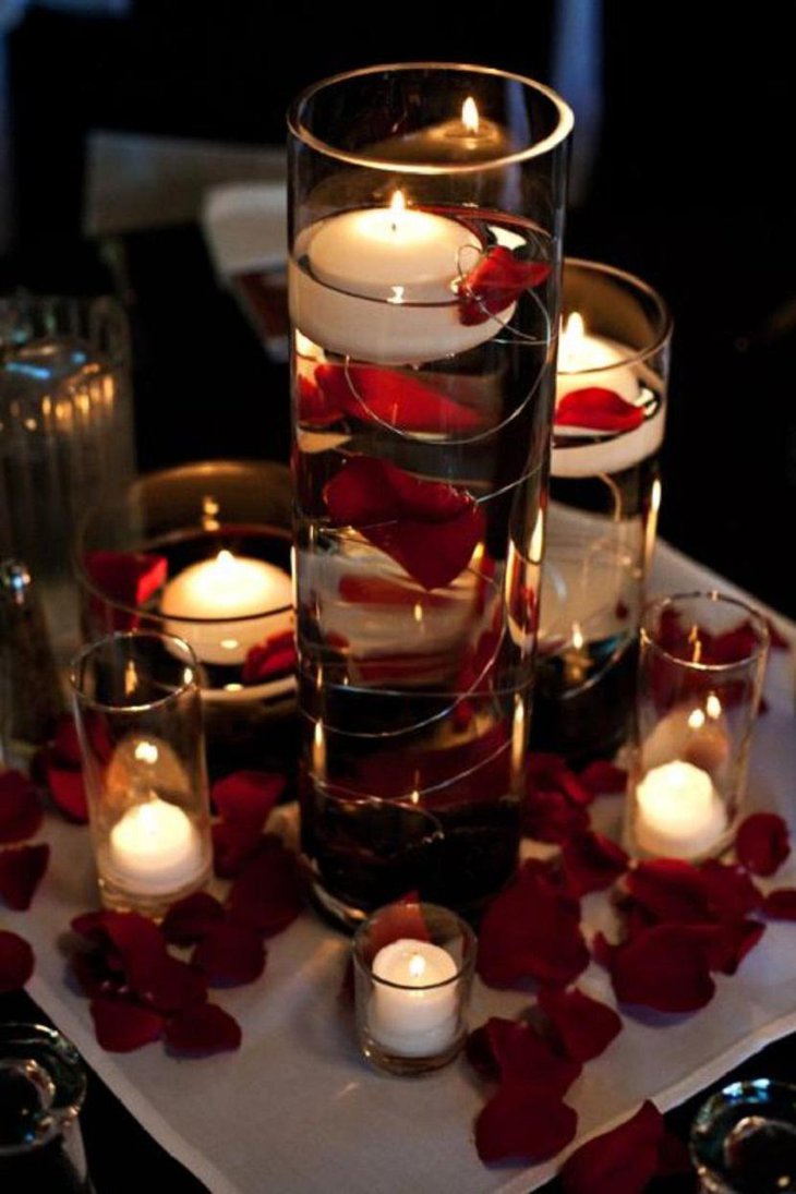 The Table Centerpiece for New Years Eve with Candles and Rose Petals