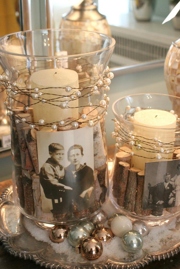 The Table Centerpiece for New Years Eve with Candles Pearls and Photographs