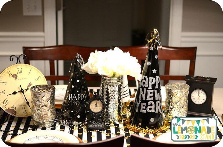 The Table Centerpiece for New Years Eve with Clocks and Hats