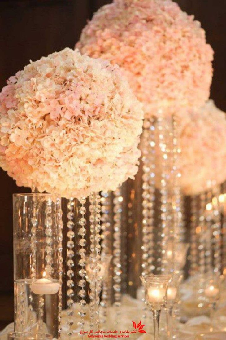 The Table Centerpiece for New Years Eve with Hanging Crystals and White Flowers