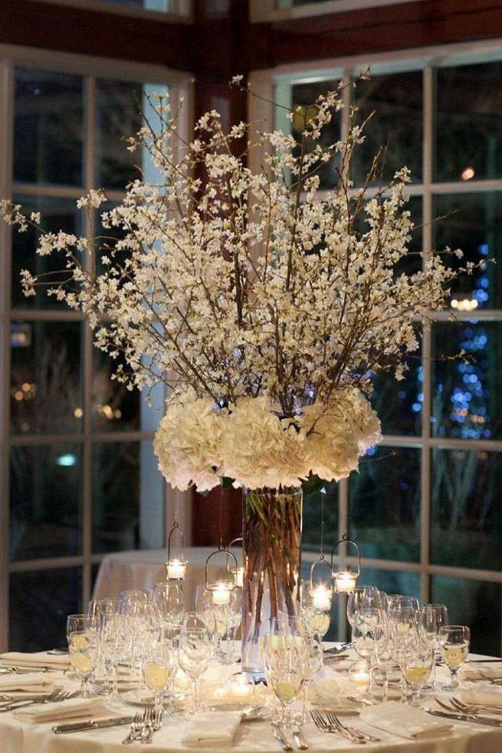 The Table Centerpiece for New Years Eve with White Flowers and Crystals