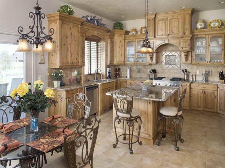 This rustic Italian table is decorated with earthy toned matts and floral centerpiece