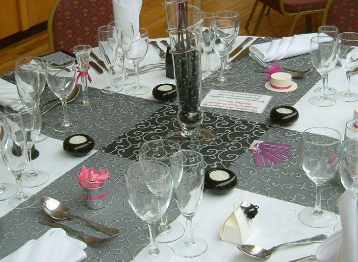 Unique white candles in black votives as summer table decor