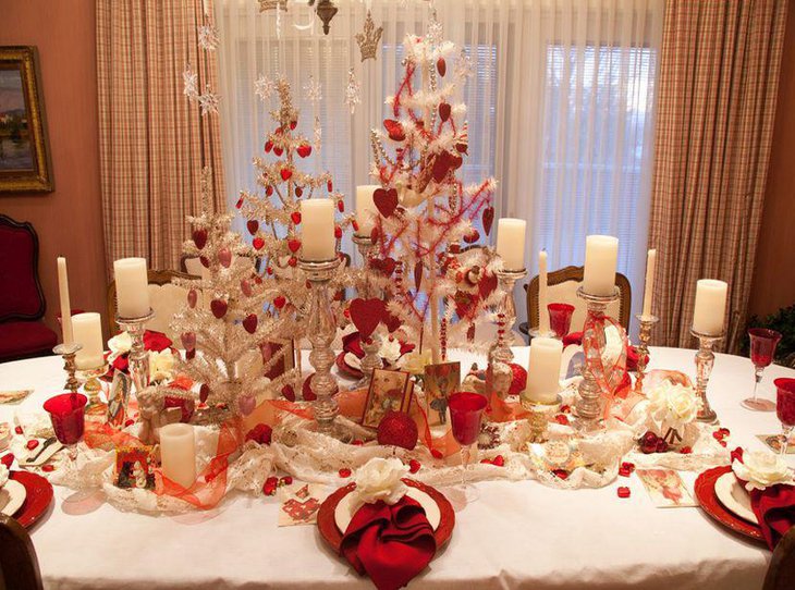 Valentines Day table decor with white candles and silver holders