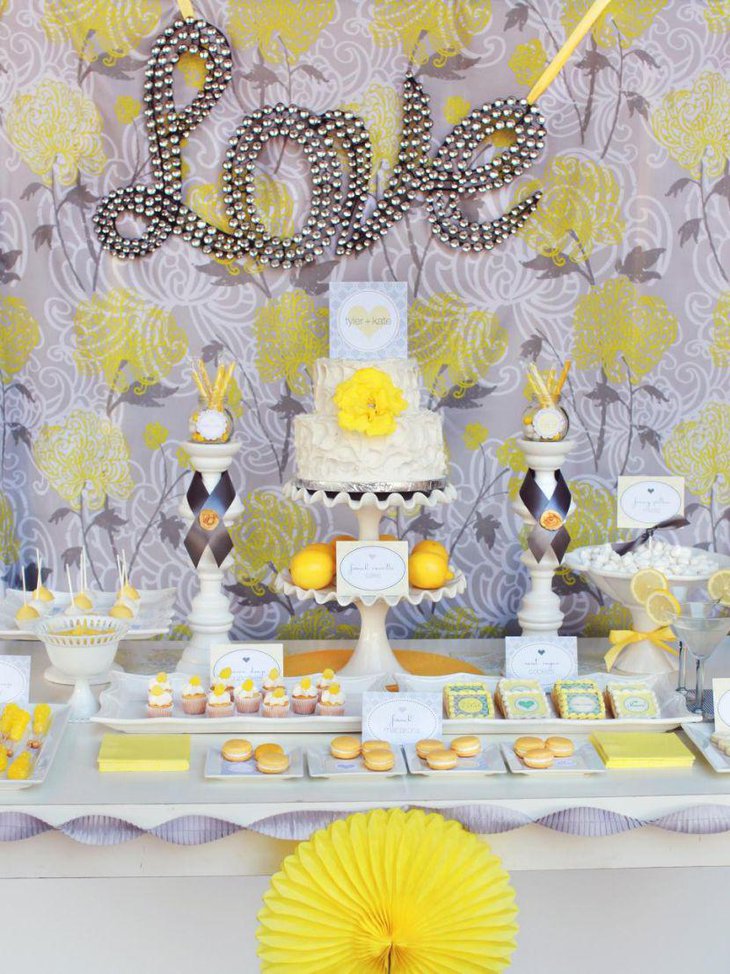 Vibrant bridal shower dessert table decoration with cake