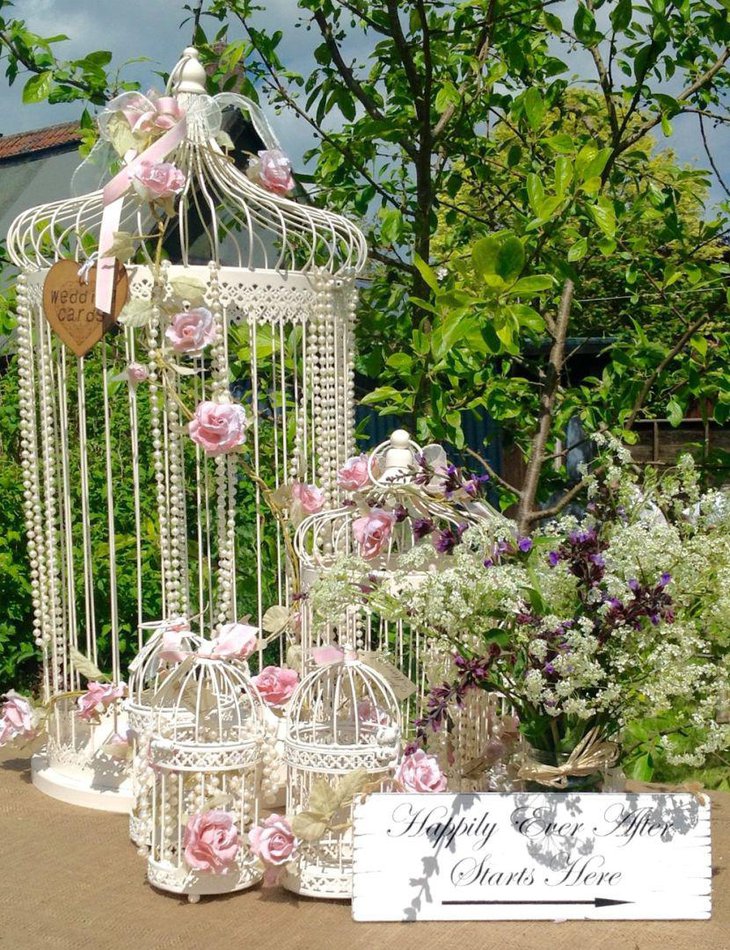 Vintage birdcage centerpiece with pretty floral decorations