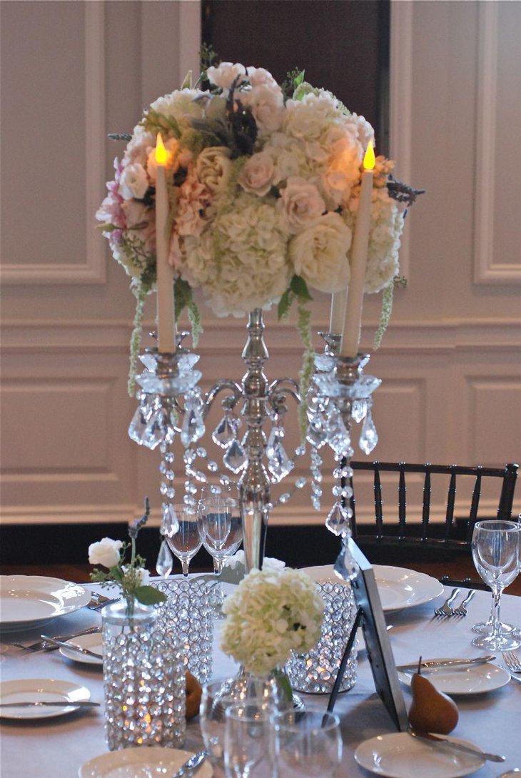 Vintage candelabra and flower wedding table centerpiece