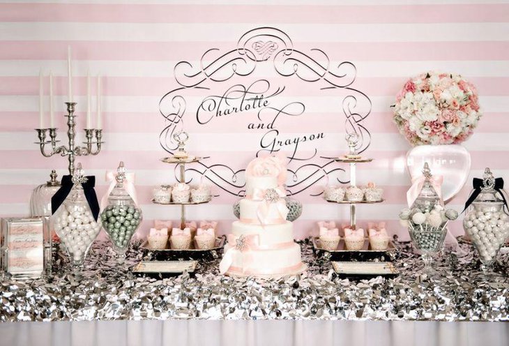 Vintage dessert table in vintage style with candelabras and flower decoration