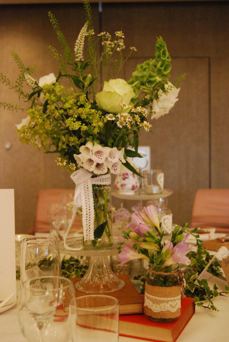 Vintage flower and burlap prop decor on wedding table