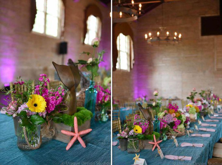 Vintage mermaid themed baby shower table decor with floral accents