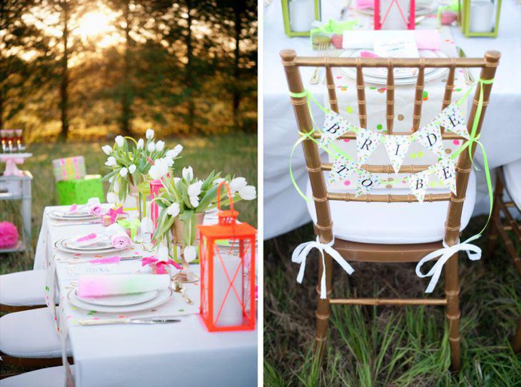 Vintage pink and white party table decor with flowers and vintage lantern