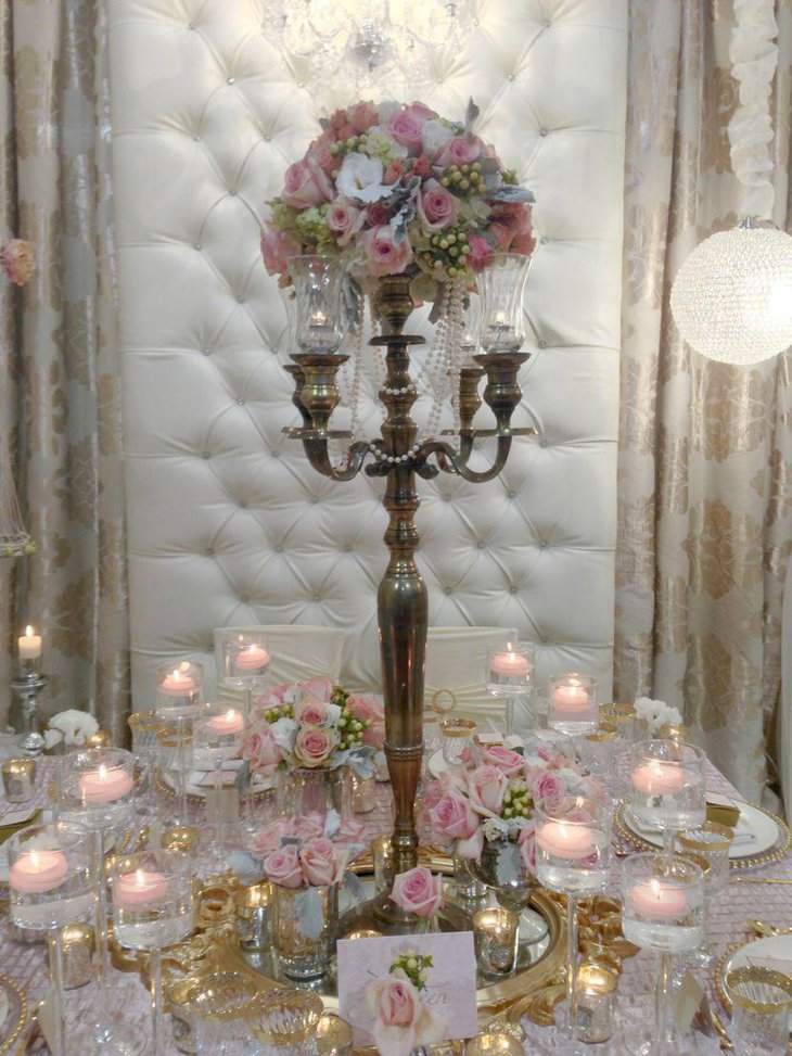 Vintage wedding table decoration with flowers and candelabra