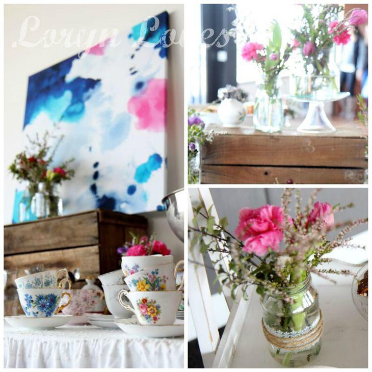 Watercolour themed cups displayed on spring birthday table