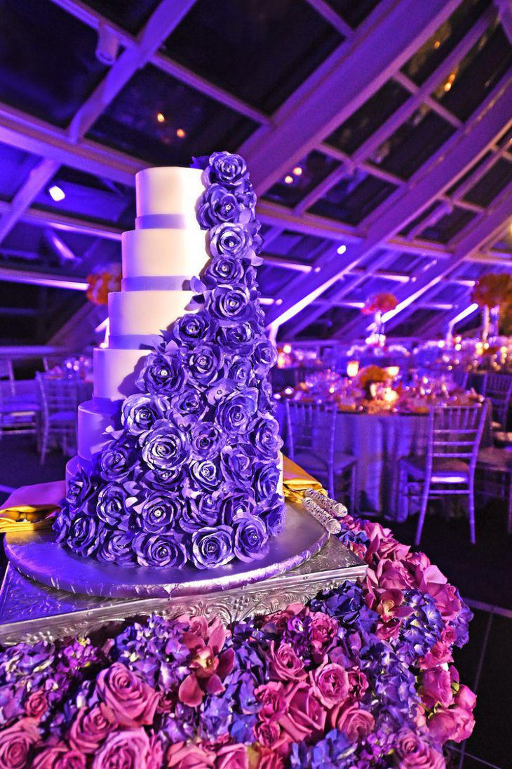 Wedding cake table decor with purple rose and hydrangea floral blanket