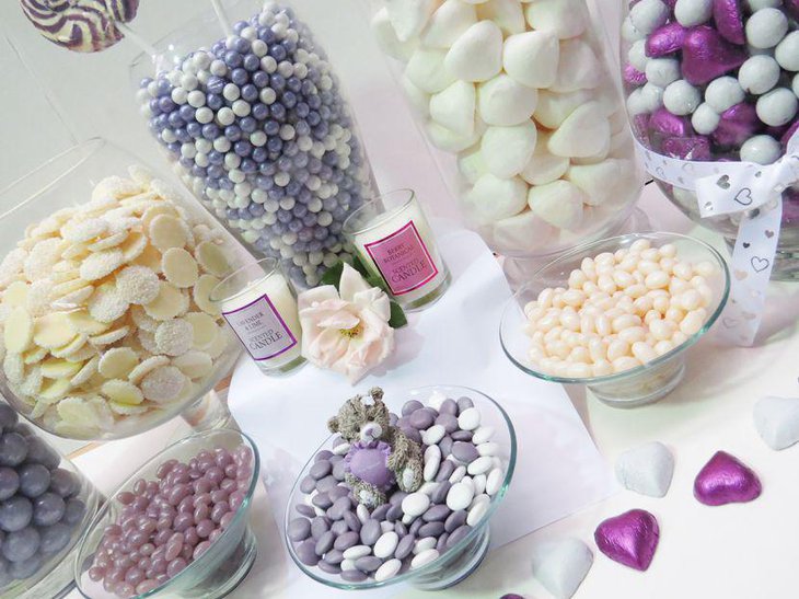 Wedding candy buffet table in purple and white