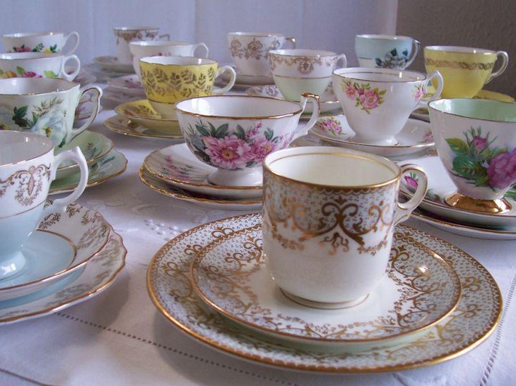 Wedding table decor with cups and gold rimmed saucers