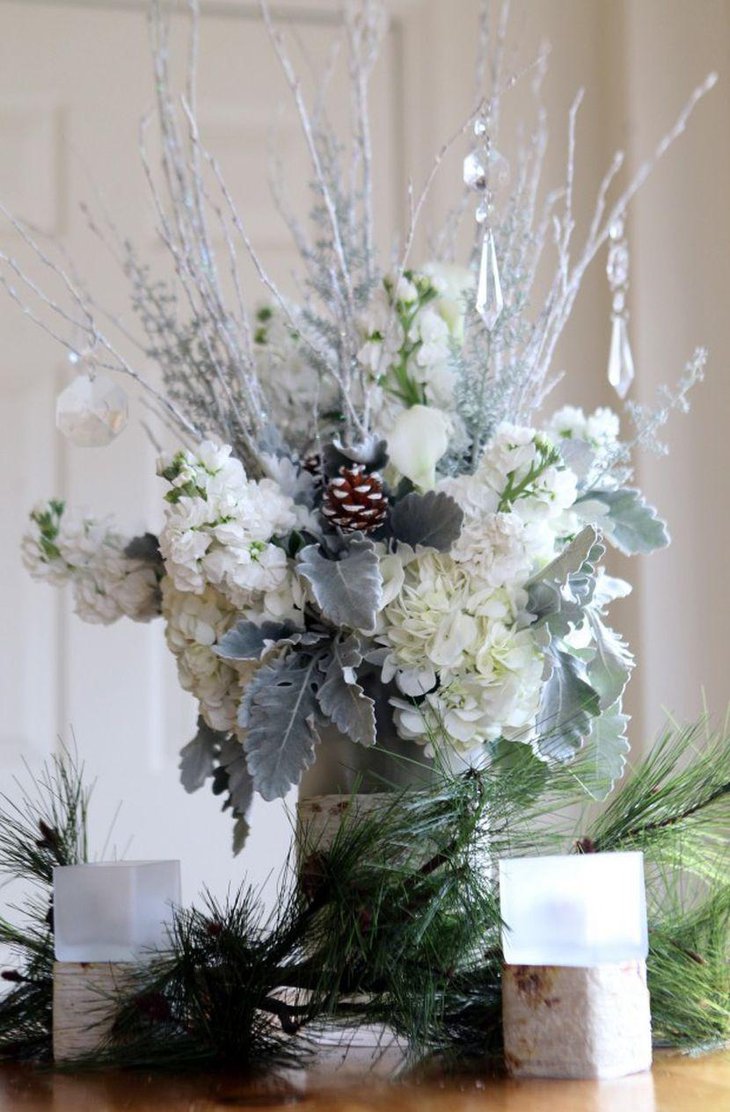 White and green floral centerpiece with hanging glass ornaments
