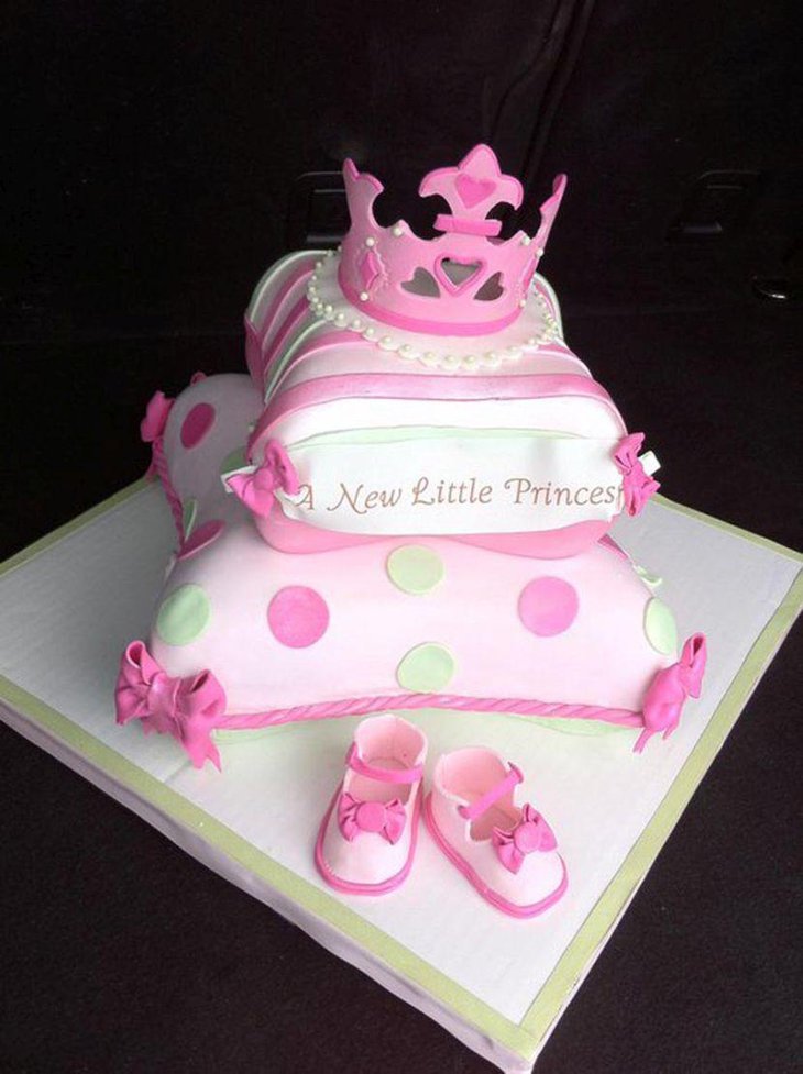 White and pink pillow cake with princess shoes and crown