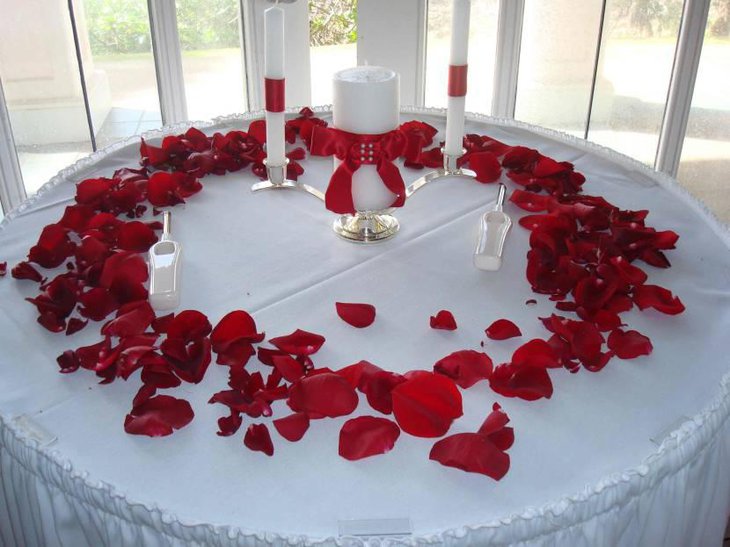 White Candle Centerpiece With Red Bow Ribbon