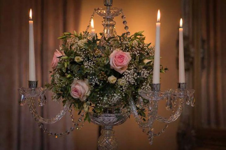 White candles on crystal candelabra table centerpiece