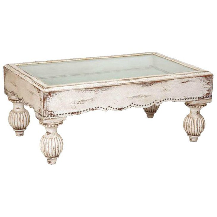 White rustic coffee table with curvey legs and glass top