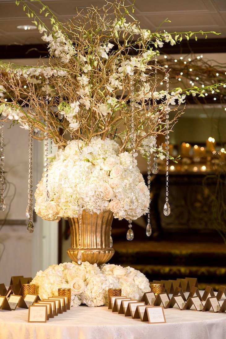 Winter wedding table decor with golden vase and place cards