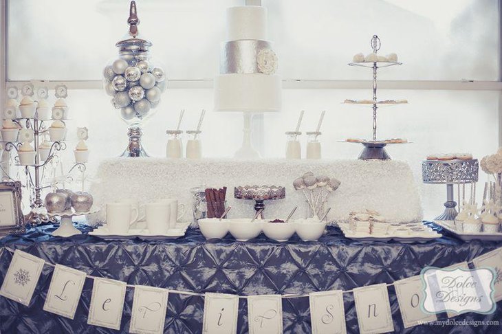 Winter wonderland dessert table with silver accents