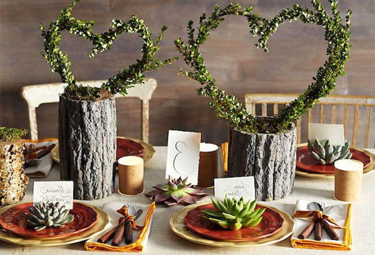 Wooden log heart centerpieces on a country wedding table