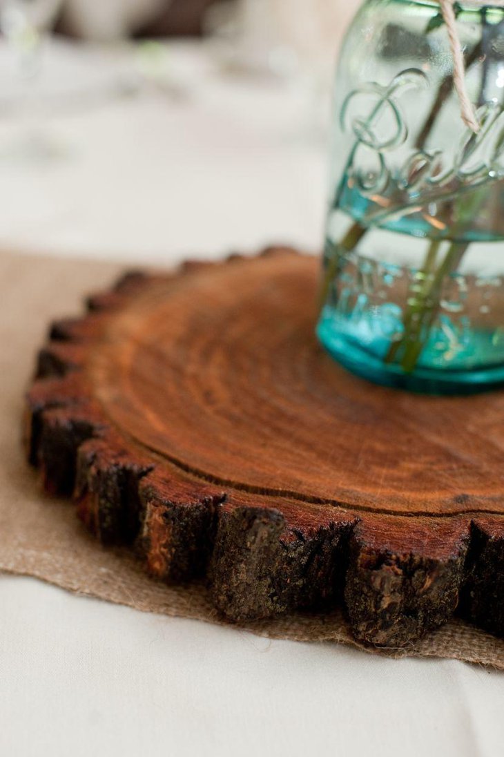 Wooden slice centerpiece on a country wedding table