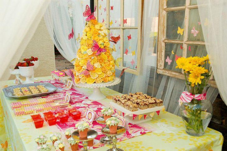 Yellow floral decor adds a cheerful touch to this spring birthday table