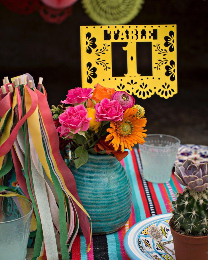 Yellow papel picado table number and floral decor